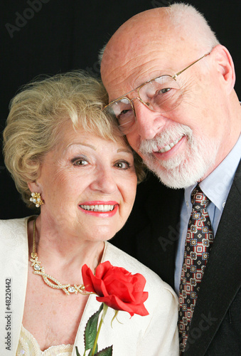 Photo: Elegant Senior Couple with Rose Elegant Senior Couple with Rose