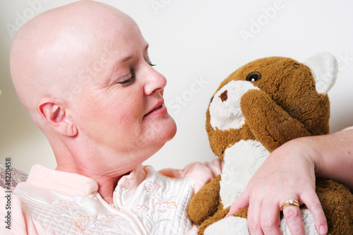 Photo: Cancer Patient Comforted by Teddy Bear Cancer Patient Comforted by Teddy Bear