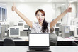 Successful businesswoman and blank monitor