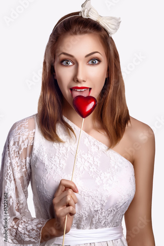 Photo: Saint Valentine Day - Happy Funny Women with Red Symbol Heart Saint Valentine Day - Happy Funny Women with Red Symbol Heart
