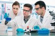 Group of young scientists experimentation in research laboratory