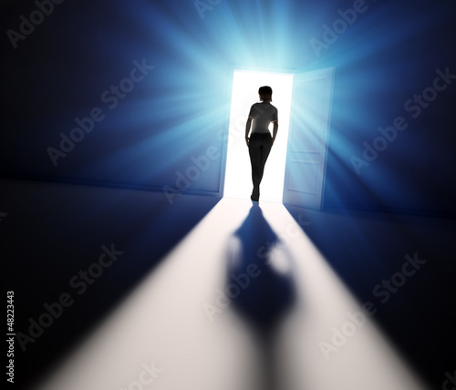 Illustration: Woman walking into light Woman walking into light
