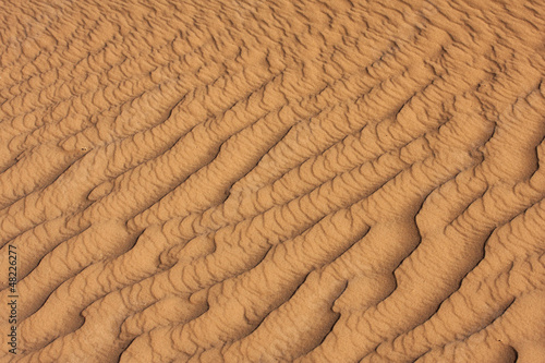 Photo: Detail of sand rippled by wind in the Sahara desert Detail of sand rippled by wind in the Sahara desert