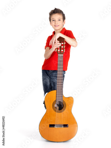 Photo: caucasian boy with acoustic guitar caucasian boy with acoustic guitar