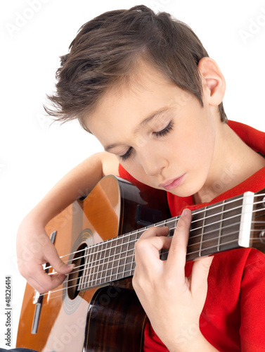 Photo: White boy is playing on acoustic guitar White boy is playing on acoustic guitar