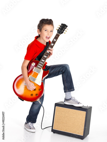 Photo: white boy sings and plays on the electric guitar white boy sings and plays on the electric guitar