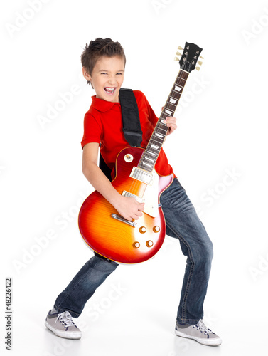 Photo: white boy sings and plays on the electric guitar white boy sings and plays on the electric guitar