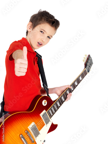 Photo: Portrait of young boy with a electric guitar Portrait of young boy with a electric guitar