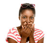 Cute African American woman hand covering mouth isolated on whit