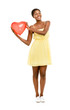 Pretty African American woman holding Red Heart Balloon isolated
