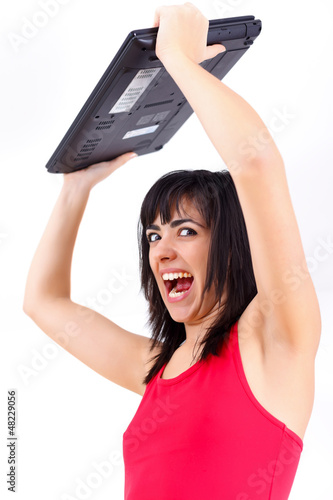 Photo: Agitated woman with laptop Agitated woman with laptop