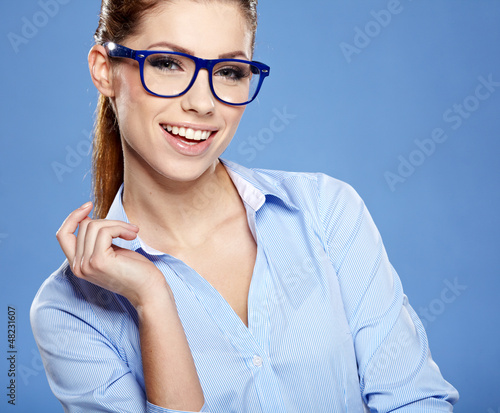 Photo: business woman in glasses on sky background business woman in glasses on sky background