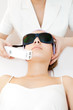 Young woman receiving laser theapy