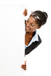 Happy African American business woman hiding behind banner isola