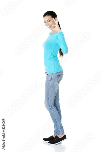 Photo: Beautiful success woman giving perfect gesture Beautiful success woman giving perfect gesture