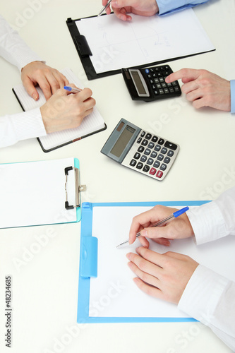 Photo: close up of business people hands during teamwork close up of business people hands during teamwork