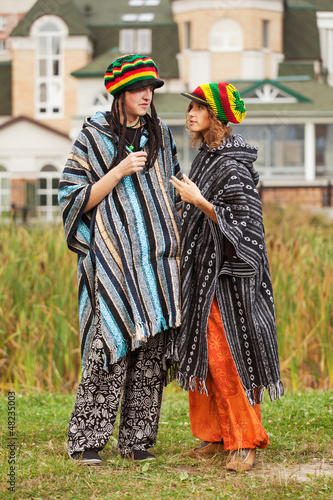 Photo: Young rastafarian couple in a city park Young rastafarian couple in a city park