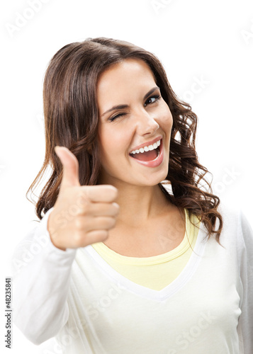Photo: Woman showing thumbs up gesture, isolated Woman showing thumbs up gesture, isolated