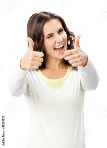 Photo: Woman showing thumbs up gesture, isolated Woman showing thumbs up gesture, isolated