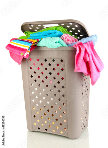 Photo: Beige laundry basket isolated on white Beige laundry basket isolated on white