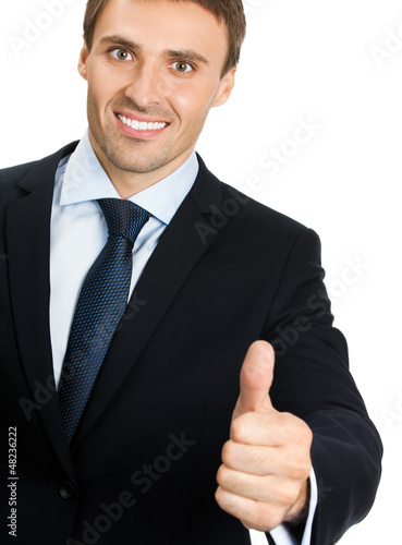 Photo: Young businessman with thumbs up gesture, isolated Young businessman with thumbs up gesture, isolated