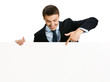 Photo: Happy businessman showing signboard, isolated Happy businessman showing signboard, isolated