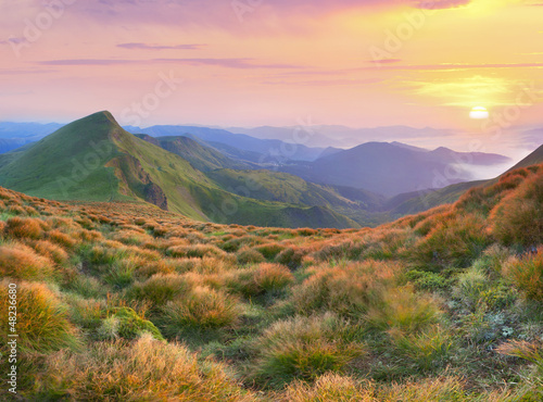 Photo: Beautiful summer landscape in the mountains. Sunrise Beautiful summer landscape in the mountains. Sunrise