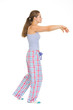Full length portrait of young woman in pajamas sleep walking
