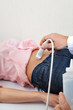 Female Going Through Abdomen Ultrasound