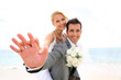 Groom giving piggyback ride to his bride