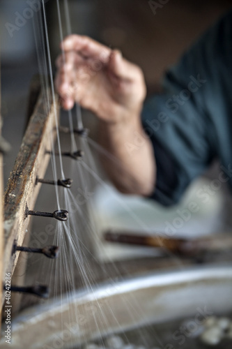 Photo: Producing silk fibers Producing silk fibers