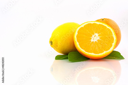 Photo: Orange and Lemon on white background Orange and Lemon on white background