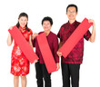 Asian Chinese family holding red spring couplets