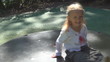 Video: Little Girl Spinning on a Merry-Go-Round, Child Playing in Park Little Girl Spinning on a Merry-Go-Round, Child Playing in Park