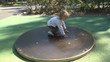 Video: Child Spinning on a Merry-Go-Round, Little Girl Playing in Park Child Spinning on a Merry-Go-Round, Little Girl Playing in Park