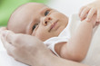 Father Holding Young Smiling Baby Hands