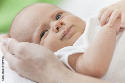Photo: Father Holding Young Smiling Baby Hands Father Holding Young Smiling Baby Hands
