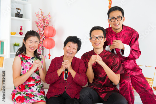 Photo: Asian family reunion at home. Asian family reunion at home.