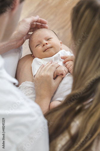 Photo: Father Mother Parents Holding Smiling Baby Father Mother Parents Holding Smiling Baby