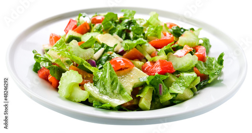 Photo: Salad from fresh vegetables, saved clipping path Salad from fresh vegetables, saved clipping path
