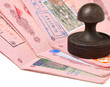 stack of passports and stamp