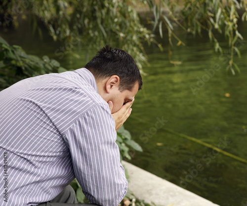 Photo: Stressed man in the park Stressed man in the park