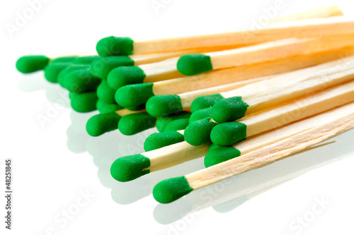 Photo: Matches close up isolated over white Matches close up isolated over white