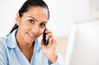 Closeup portrait of happy Indian businesswoman talking using mob