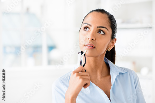 Photo: Indian business woman thinking future Indian business woman thinking future