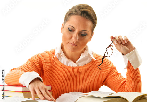 Photo: Young woman reading a book. Female student learning Young woman reading a book. Female student learning