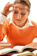 Young woman reading a book. Female student learning