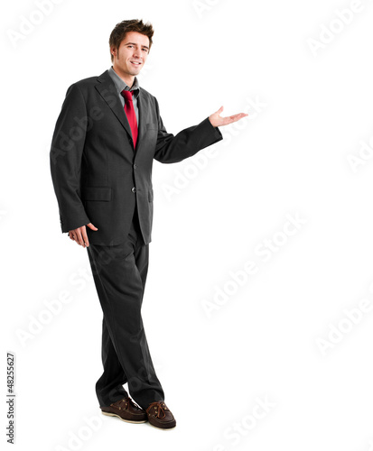 Photo: Full length businessman showing something Full length businessman showing something