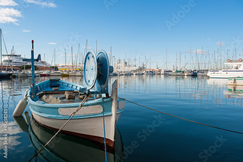 Photo: Yachts in Toulon port, France, with small boat in the foreground Yachts in Toulon port, France, with small boat in the foreground