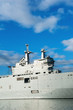 Photo: Military ship detail over blue sky. Military ship detail over blue sky.